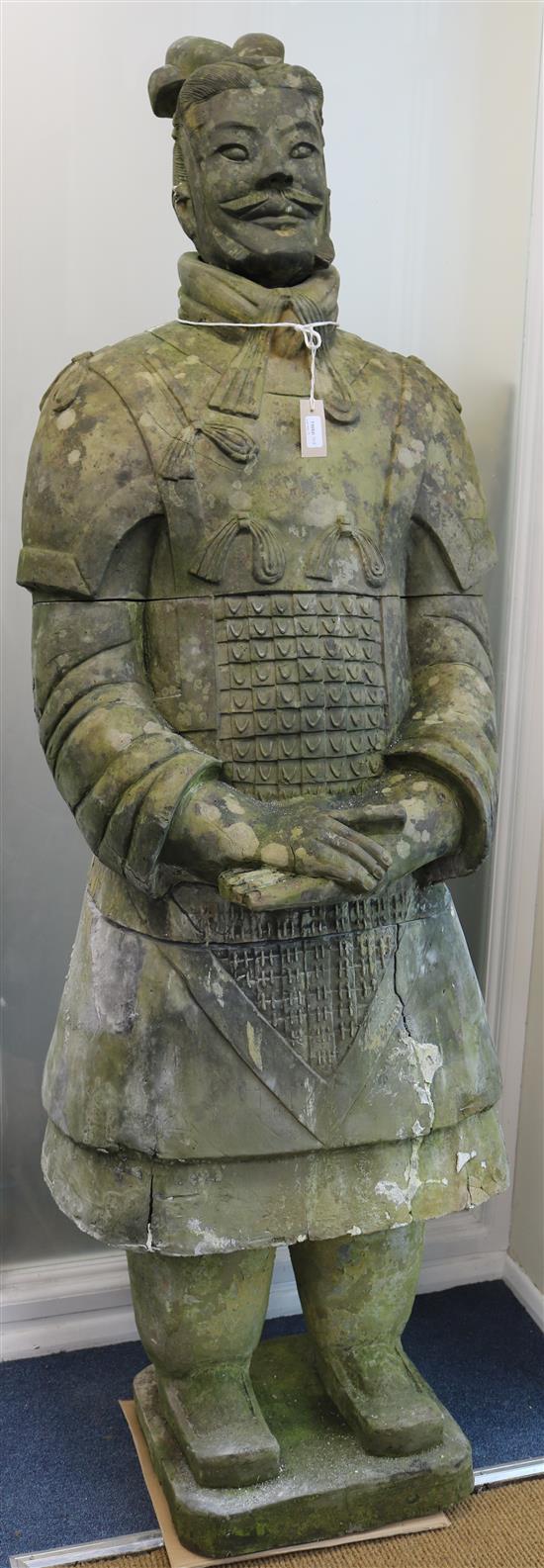A Chinese terracotta warrior on plinth, H .190cm approx (some damage)